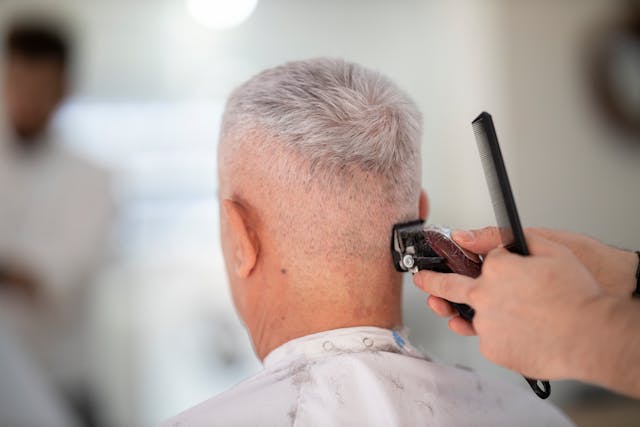 barber using clippers