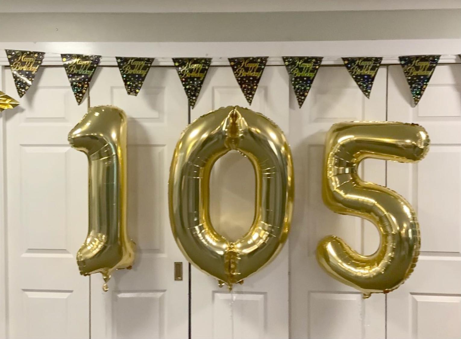 gold number balloons for 105th birthday