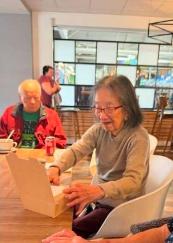 care home residents in garden centre cafe