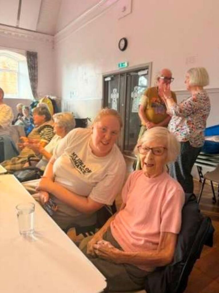 resident smiling at lively local seniors club
